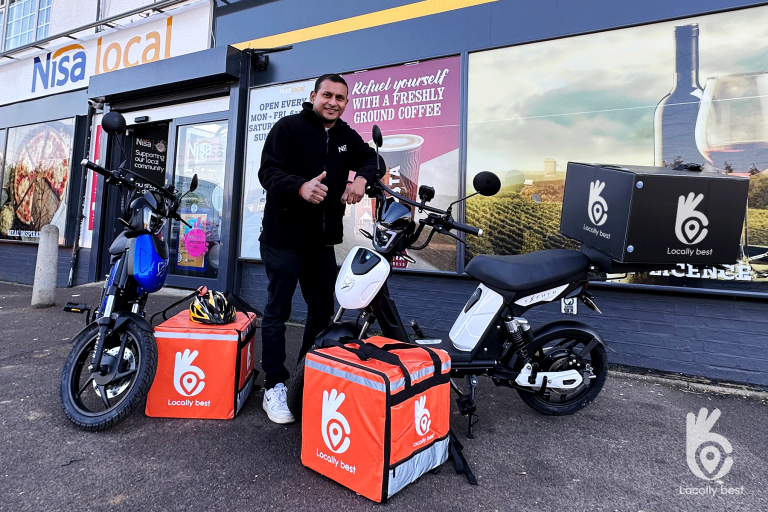 Adi, the owner of Nisa Local in Arlesey, is currently testing electric bikes for his grocery delivery service.